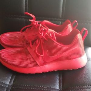 Red mesh Nike shoes. Used. Good condition.
